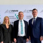 Representatives of Kauno kolegija and Caucasus University during a strategic visit, standing in front of a backdrop featuring Kauno kolegija and UNINOVIS alliance logos.