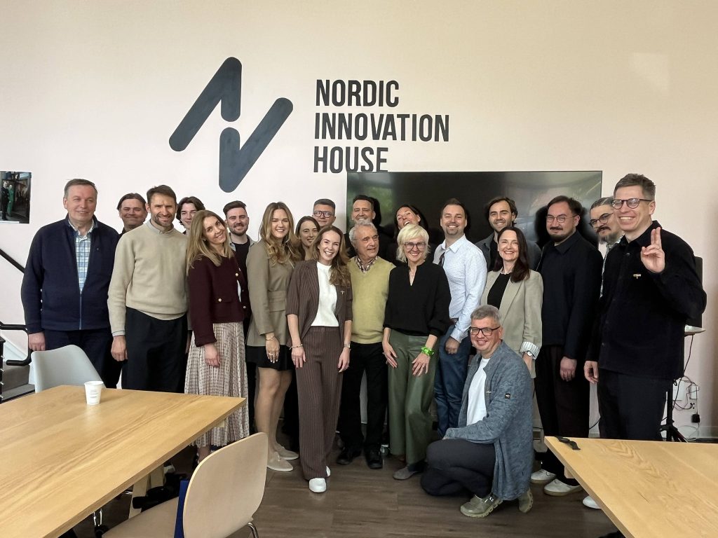 A large group of professionals, including representatives from Kaunas University of Applied Sciences and the Lithuanian ICT delegation, posing at the Nordic Innovation House in Silicon Valley, USA.