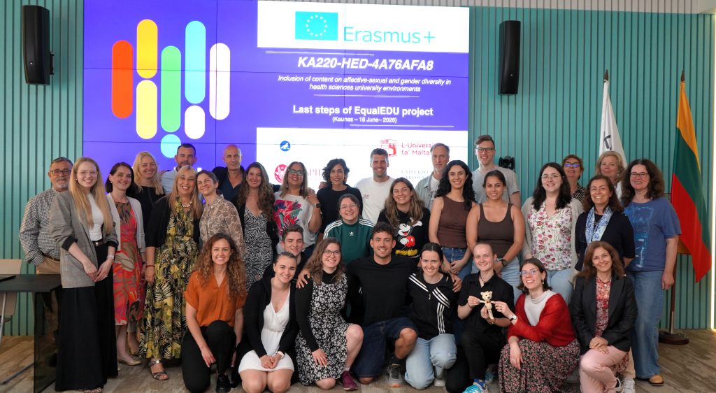 Participants of the Erasmus+ EqualEdu final international meeting and conference pose for a group photo at Kauno kolegija Higher Education Institution in Kaunas, Lithuania, in front of the EqualEdu project presentation screen, celebrating the successful completion of the project.